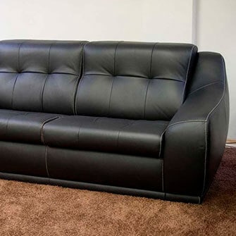 Перетяжка дивана из черного кожзаменителя